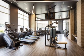 A gym with treadmills and other exercise equipment